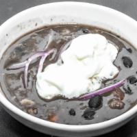 Black Bean Soup · Gluten-free. Assorted sausages, black beans and spices topped with red onions and sour cream.