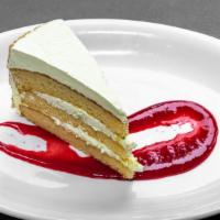 Lemon Cake With Raspberry Sauce · Lemon scented yellow cake with lemon butter cream icing.