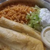 Chimichanga · Shredded chicken and ground beef. combinations are served with rice and beans.
