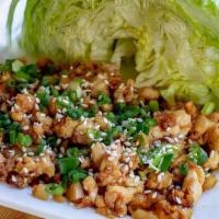 Chicken Lettuce Wraps · Sauteed chicken, water chestnuts, crispy noodles, served with iceberg lettuce and soy vinaig...