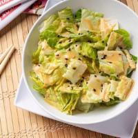 Ginger Salad · Chopped romaine with shredded carrots topped with a sweet refreshing ginger sesame dressing.