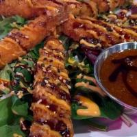 Tnt Shrimp · It's dy-na-mite! Crispy shrimp tempura glazed with sweet chili, savory eel sauce and a sprin...