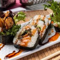 Spider Roll · Soft shell crab tempura, cucumber, avocado, spring mix inside, topped with sweet chili and e...