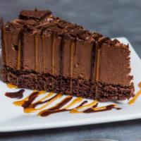 Double-Layered Chocolate Cake · served drizzled with chocolate and caramel syrup.