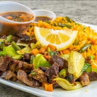 Beef Suqaar · Chopped, stir-fried, tender beef, sautéed with mixed vegetables, green peppers, onions, and ...