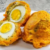 1 Pc. Nafaqo · Seasoned, mashed potatoes, stuffed with a whole boiled egg, then coated in batter to deep fry.