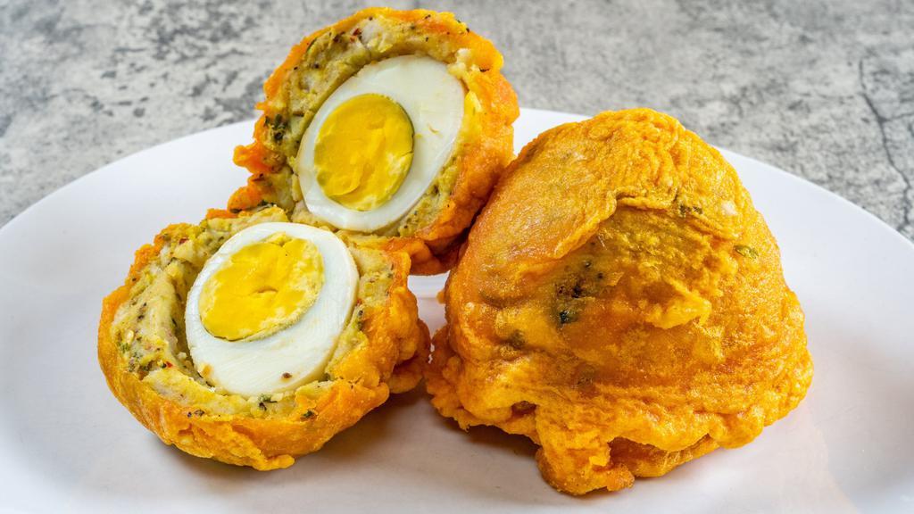 1 Pc. Nafaqo · Seasoned, mashed potatoes, stuffed with a whole boiled egg, then coated in batter to deep fry.