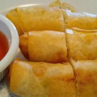 Egg Rolls · Homemade and crispy fried vegetarian spring rolls with Thai cafe sweet and sour sauce.