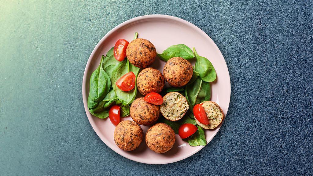 Falafel Fun · Delicious, nutritious balls of ground chickpeas which is crispy and crunchy on the outside and moist on the inside. Served with a side of hummus
