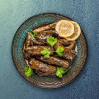 Stuffed Grape Leaves · Grape leaves are filled with a mixture of rice, onions, mint and spices, and then gently ste...