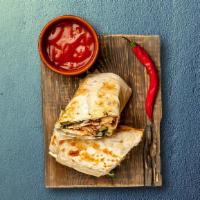 Grilled Chicken Shawarma Wrap · Chicken is marinated in spices and then grilled, served with cucumber sauce lettuce and toma...
