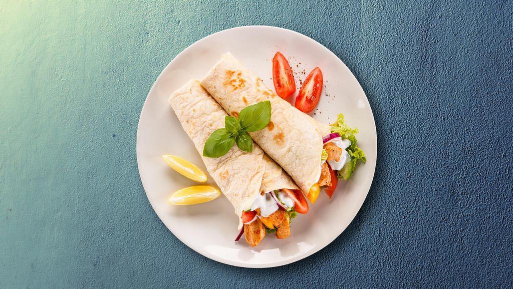 Shredded Chicken Gyro Wrap · Marinated spiced chicken, grilled to perfection, served with onino, siracha sauce cucumber sauce, lettuce and tomato.