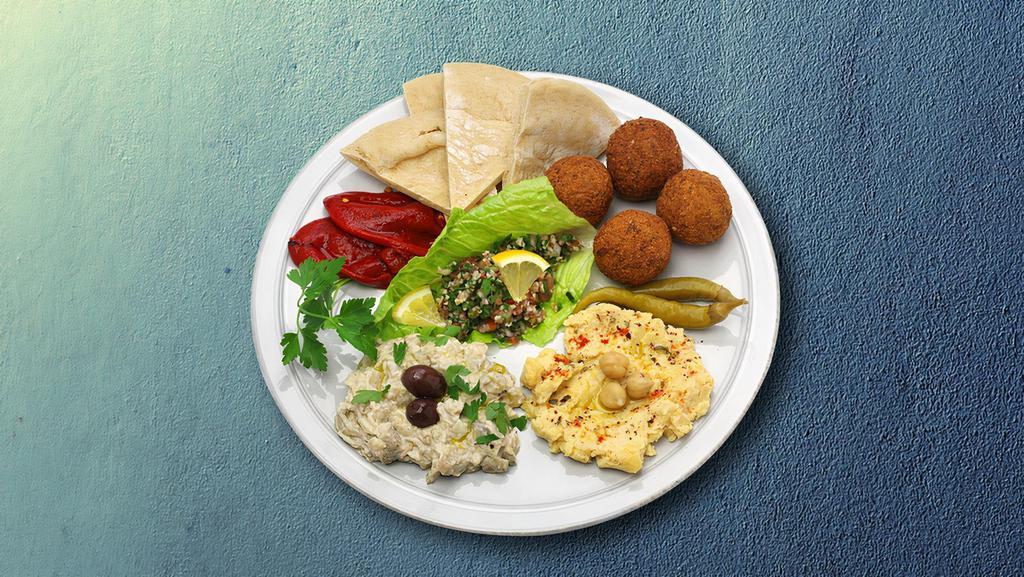 Vegetarian Combo Dinner · Vegetarian combo dinner comes with fresh Greek salad, cucumber sauce, grape leaves and grilled pita.