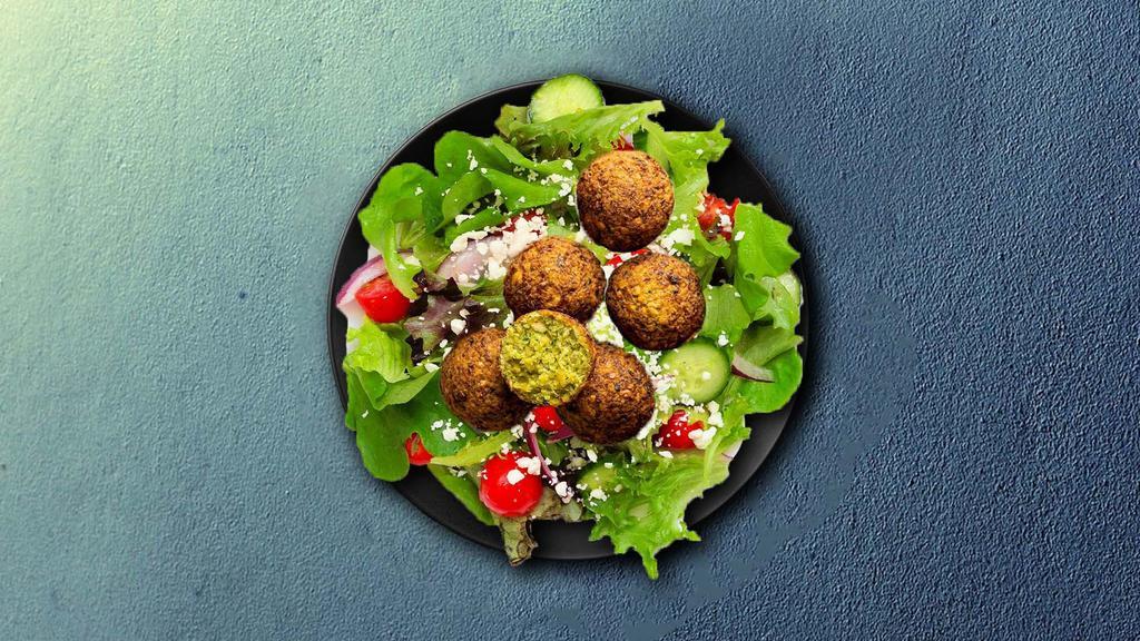 Falafel Feast Platter · Falafel plate served with five pices of falafel, hummus and tabouleh salad.
