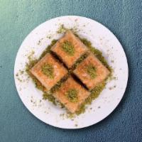 Baklava Pistacho Bite · A layered pastry dessert made with filoÂ pastry, filled with chopped nuts, and sweetened wit...