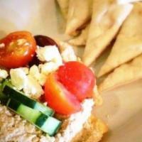 Hummus & Pita · House-made hummus topped with Greek salad.  Served with hot pita bread.