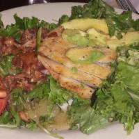 Cobb Salad · Mixed greens topped with marinated chicken breast, tomatoes, avocado, hard-boiled egg, slice...