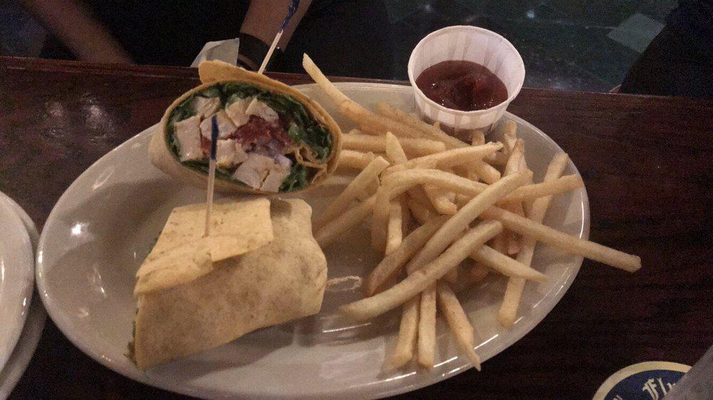 Grilled Chicken Caesar Wrap · Grilled chicken, lettuce, sundried tomato, red onions, Italian cheese and Caesar dressing. Served with your choice of side.