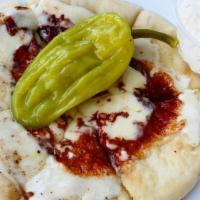 Pita Mozz · Pita bread with melted mozzarella, grilled onions, and bell peppers served with Zeek's feta ...
