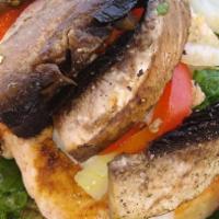 Grilled Wild Salmon · Grilled wild salmon, quinoa, spinach severed with sweet peppers, portabella mushrooms onions...