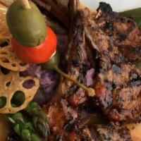 Grilled Lamb Chops · Grilled lamb chops, asparagus severed with garlic potatoes brushed in our specialty sauce. F...