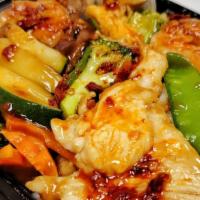 Triple Delight · Chicken, shrimp, beef, broccoli, snow peas, baby corn, zucchini, carrot, napa and mushroom i...