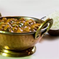 Chana Masala · Vegetarian, gluten-free. Chickpeas cooked with onions and fresh tomato sauce with exotic spi...