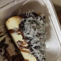 Coconut Chocolate Cheese Cake · Cheese cake dripping in chocolate and coconut.
