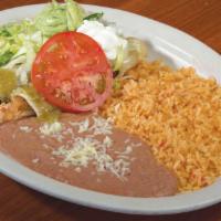 Enchiladas Verdes · One chicken, one cheese, and one spinach enchilada, topped with lettuce, sour cream, green s...