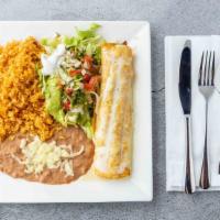 Chimichanga · A flour tortilla stuffed with your choice of shredded beef or spicy chicken, then deep-fried...