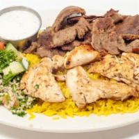 Combo 3 · Gyro, beef shish, and grilled chicken served with rice, salad, and pita.
