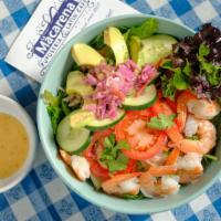 Shrimp & Avocado Salad · Organic greens mixed with Latin-style slaw topped with avocado, cucumbers and tomatoes.