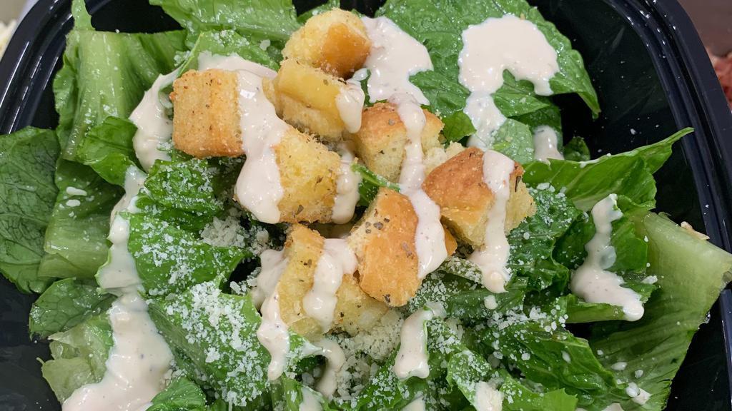 Caesar Salad · Romaine lettuce, caesar dressing, croutons, shredded Parmesan cheese.
