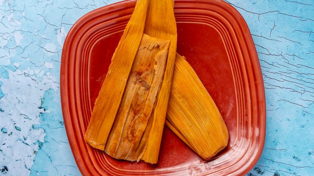Homemade Traditional Tamales (3) · Pork or Chicken. Served in  a corn Husk.