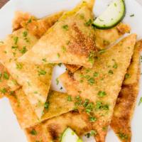 Bolanee Kachalou · Fried turnovers filled with potatoes, herbs, and spices.