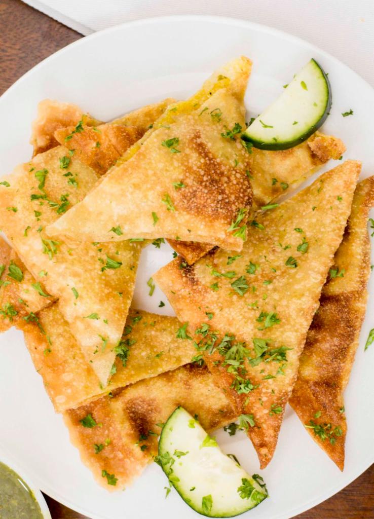 Bolanee Kachalou · Fried turnovers filled with potatoes, herbs, and spices.