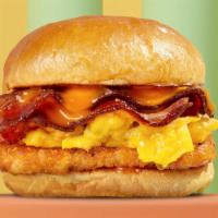 House Breakfast Sandwich · Eggs with crispy bacon, hash brown, melted cheese, and house sauce.