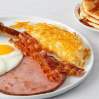 Ultimate Breakfast · 2 strips of bacon, 2 sausage links & grilled ham steak served with 2 eggs, choice of hash br...