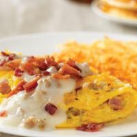 Country Music Star · Filled with diced country sausage, ham, onions & topped with country gravy, Monterey Jack ch...