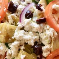 Artichoke Salad · Romaine and iceberg salad, tomatoes, Spanish onions, Greek olives, feta cheese and artichoke...