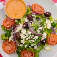 Greek Salad · Romaine and iceberg lettuce, tomatoes, Spanish onions, kalamata olives green peppers and fet...