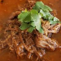Ropa Vieja Platter · Shredded flank steak cooked in stew sauce with rich flavors. Served with white rice, black b...