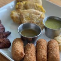 Havana Sampler · Fried yuca, chicken croquetas, maduros, and tostones. Served with a side of homemade mojo an...
