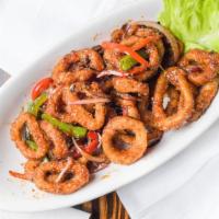 Pub Calamari · Sweet chili glazed wok fired calamari served with red and green bell peppers and red onions.