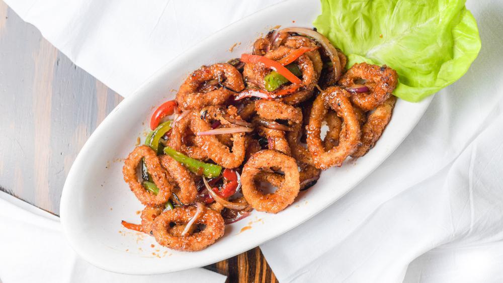 Pub Calamari · Sweet chili glazed wok fired calamari served with red and green bell peppers and red onions.