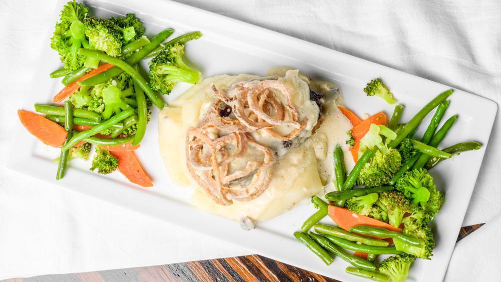 Bacon Encrusted Meatloaf · Certified Angus Beef. Served with chef’s vegetables and garlic mashed potatoes topped with white mushroom gravy.