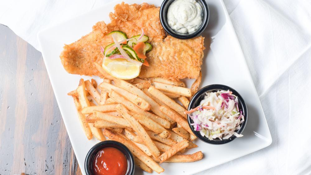 Pub Fish Fry · Beer battered fish topped with cucumber salad, served with citrus jalapeño slaw, hand cut fries, and homemade tartar sauce.