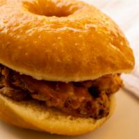 Ky Fried Buttermilk Chicken Sandwich · served on a doughnut of sweet & tangy hot sauce.