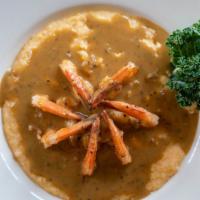 Bbq Shrimp And Grits · Jumbo shrimp simmered in our homemade New Orleans-style BBQ sauce, over a bed of creamy,
 ho...