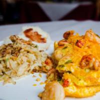 Seafood Omelette · Crawfish, shrimp, mushrooms, green onions, bell peppers and cheddar cheese. Served with hash...